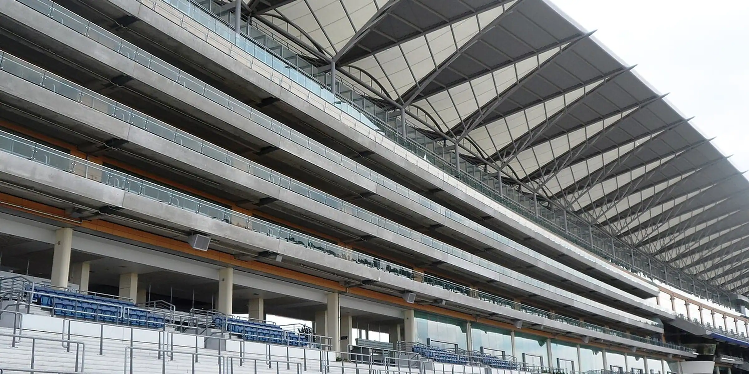 The long grandstand roof and rows of empty seats at Ascot