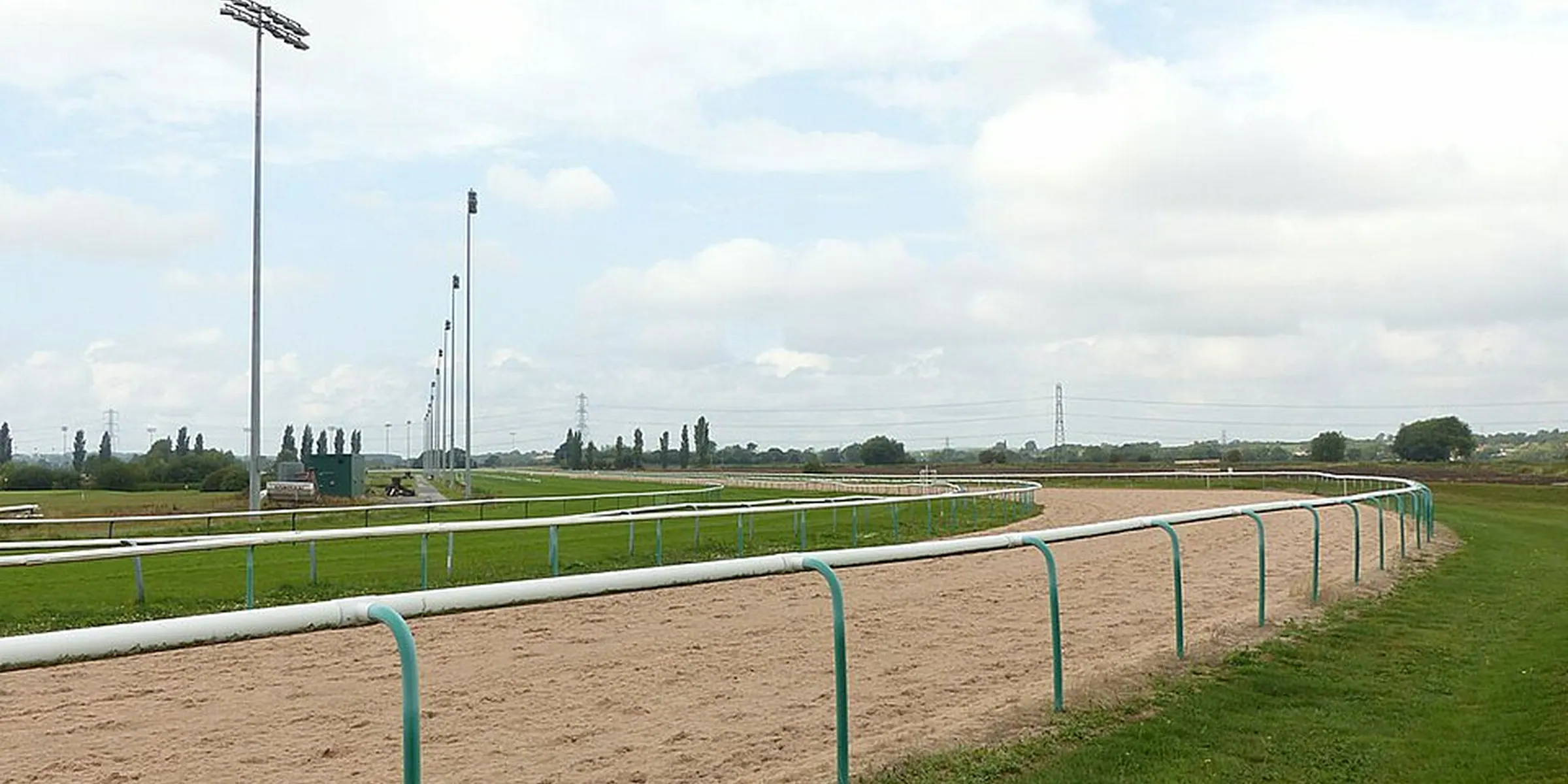 Southwell’s sand-coloured all-weather surface curving past white rails